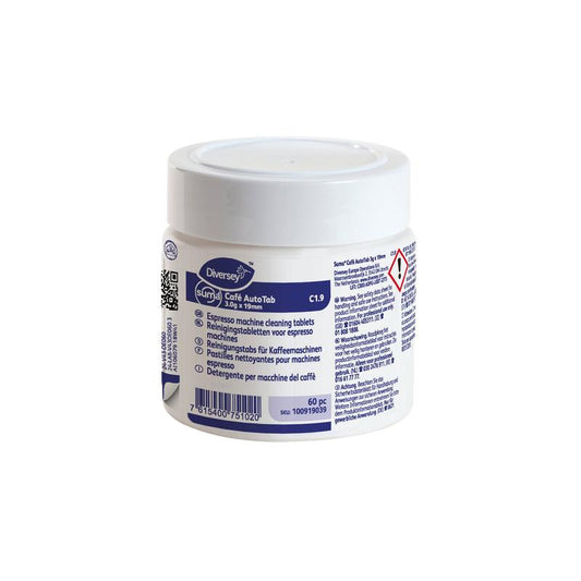 Ein weißer Kunststoffbehälter mit Suma Café Auto Tab 3gx19mm C1.9 Reinigungstab für Espressomaschinen (60 Stück) von Diversey Deutschland GmbH & Co. OHG, mit mehrsprachigem Etikett und Gefahrensymbol, für die Reinigung von Kaffeefette und -öle.