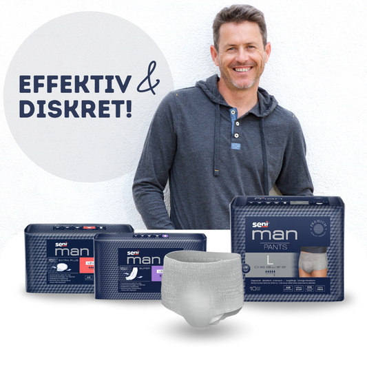 Ein Mann, der vor einer Auswahl von Inkontinenzprodukten von Seni steht