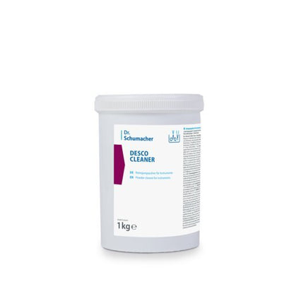 Dr. Schumacher DESCO CLEANER i hvid plastbeholder (1 kg) fra Dr. Schumacher GmbH med blå skrift, lilla designelement og hvidt skruelåg. Velegnet til alle overflader og sikrer stribefrie resultater.