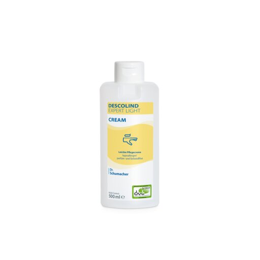 Hvid 500 ml-flaske Dr. Schumacher DESCOLIND EXPERT LIGHT CREAM håndcreme fra Dr. Schumacher GmbH, med gul etiket med produktinformation på tysk, grønt logo nederst til højre og henvisning til pleje af følsom hud.