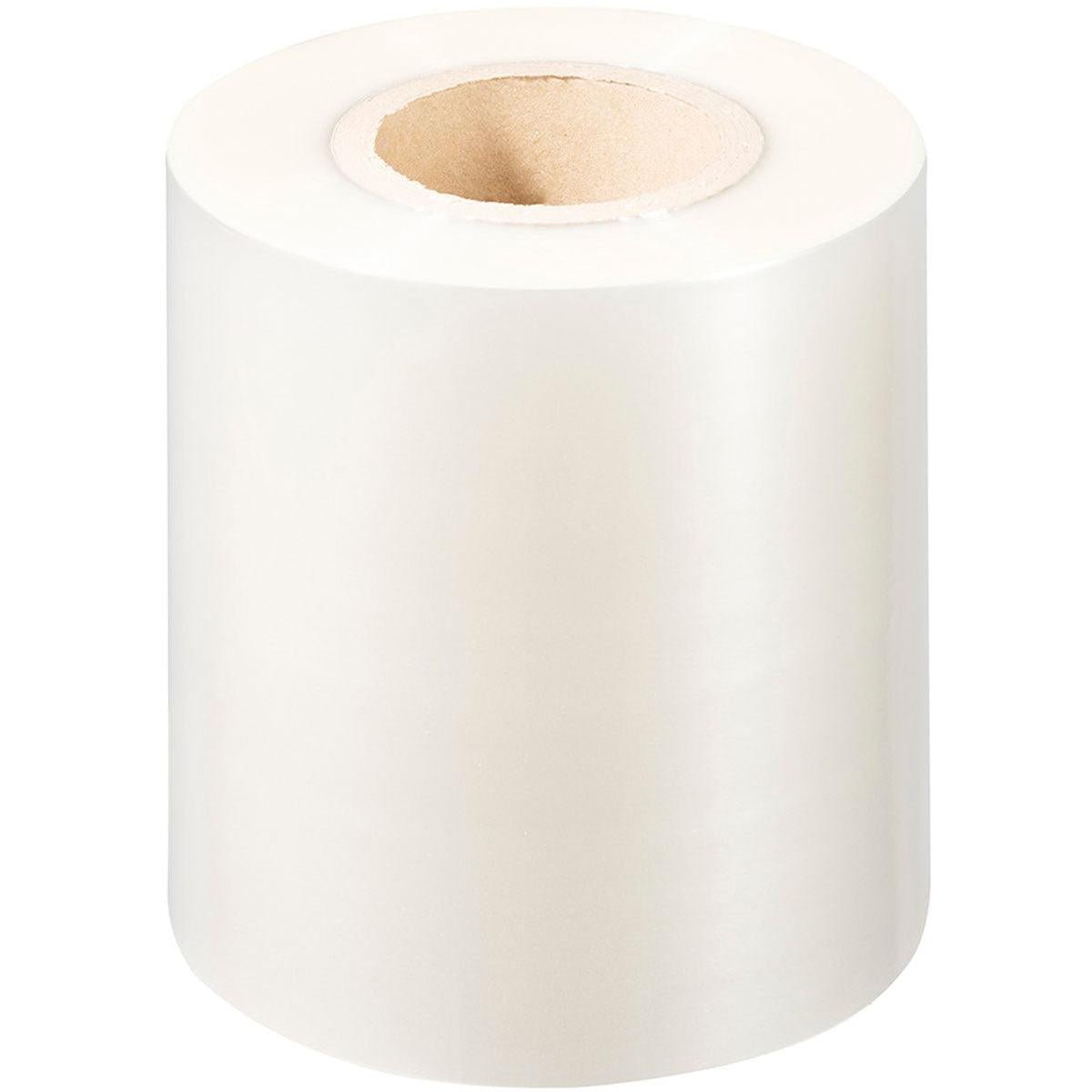 En stor rulle Duni GmbH PP-forseglingsfolie Antifog med papkerne, stående opret på hvid baggrund - perfekt til Antifog- og fødevareemballageapplikationer.