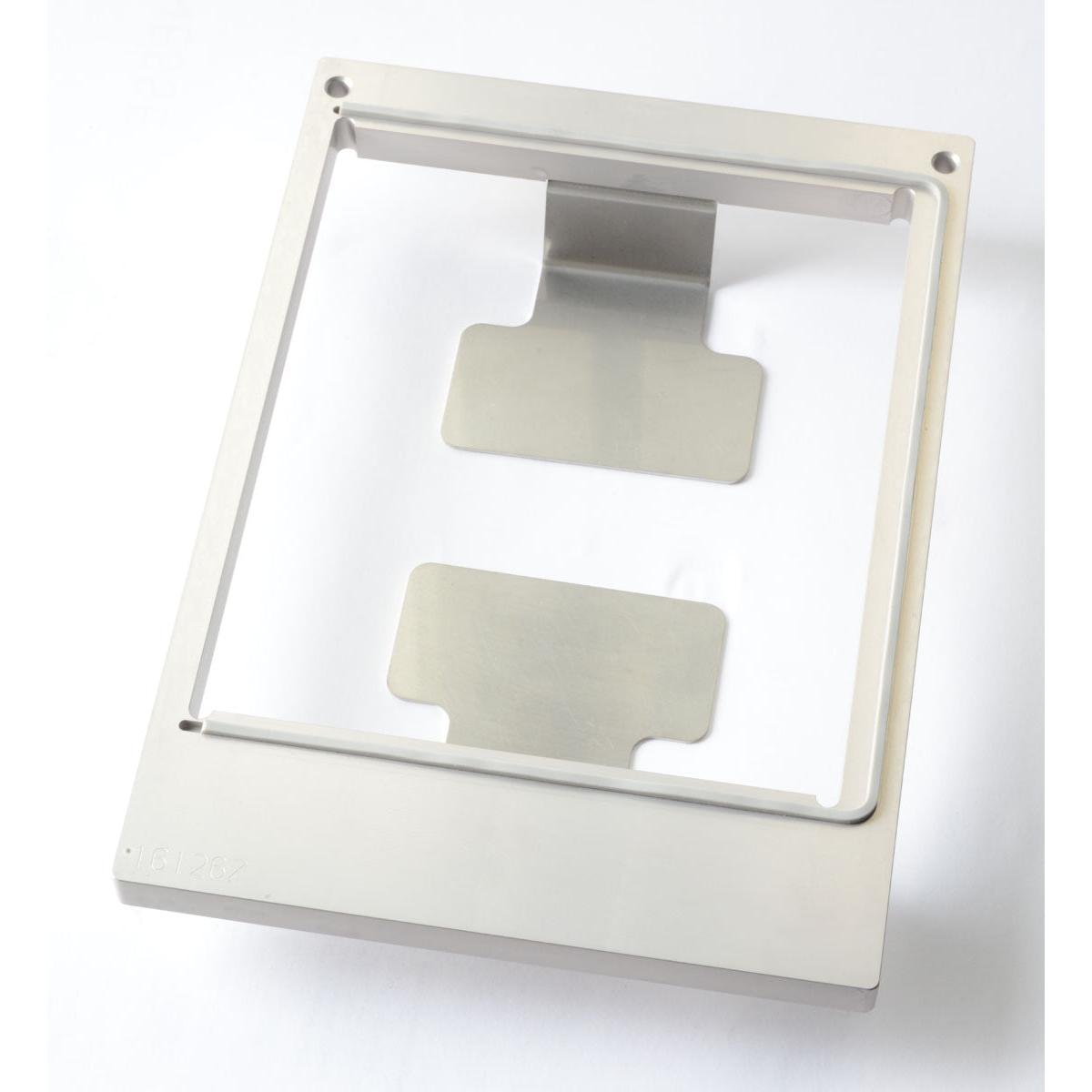 Duni GmbH-kassetten DF10/20 til papæske er en rektangulær metalramme (1200 ml, L) med to flade plader indeni og små hjørnehuller, perfekt til kompakt opbevaring, afbildet på hvid baggrund.