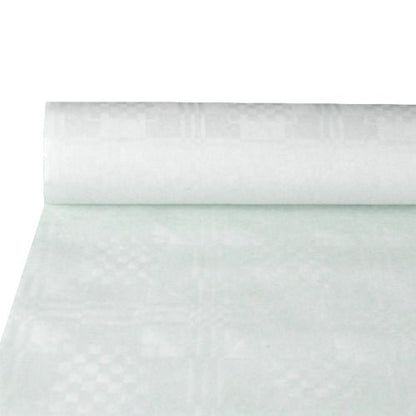 En delvist udrullet rulle PAPSTAR GmbH papirserviet med damastprægning, hvid (10 m x 1,2 m), fremhæver den elegante struktur – ideel til et stilfuldt dækket bord. Den enkle baggrund leder opmærksomheden hen på den eksklusive damastprægning.
