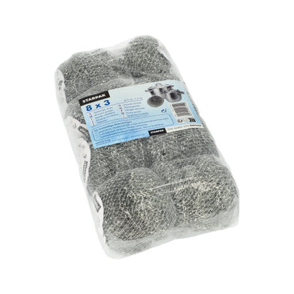 En gennemsigtig, plastikindpakket pakke med tre Starpak tråd-grydesvampe (Ø 7 cm, 2 cm, skrubbende) med teksten „Starpak“. Den blå-hvide etiket reklamerer for en effektiv rengøringsløsning til gryder og pander på flere sprog.