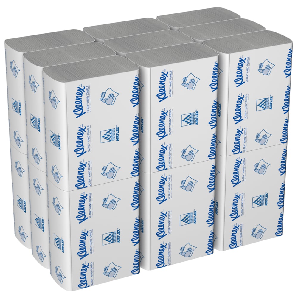 En kasse Kleenex® Ultra™ håndklæder fra Kimberly-Clark GmbH indeholder 18 hvide MultiFold-pakker à 150 ark med blå tekster og symboler på emballagen.
