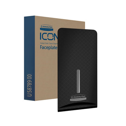 En sort Kimberly-Clark Professional™ Icon™ Dispenser Faceplate - FTT (27,80 x 13,10 x 1,40 cm) fra Kimberly-Clark GmbH er set foran den brun-blå emballage med teksten "Folded Toilet Tissue Dispenser Faceplate", som er ideel til moderne toiletrum.