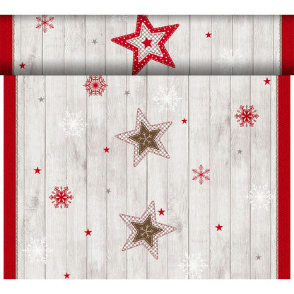 Dunicel-Tete a Tete 0,4x24m fra Duni GmbH viser røde, hvide og brune stjerner med snefnug på en lys træbaggrund med rød kant - ideel som en elegant bordløber til enhver festlig borddekoration.