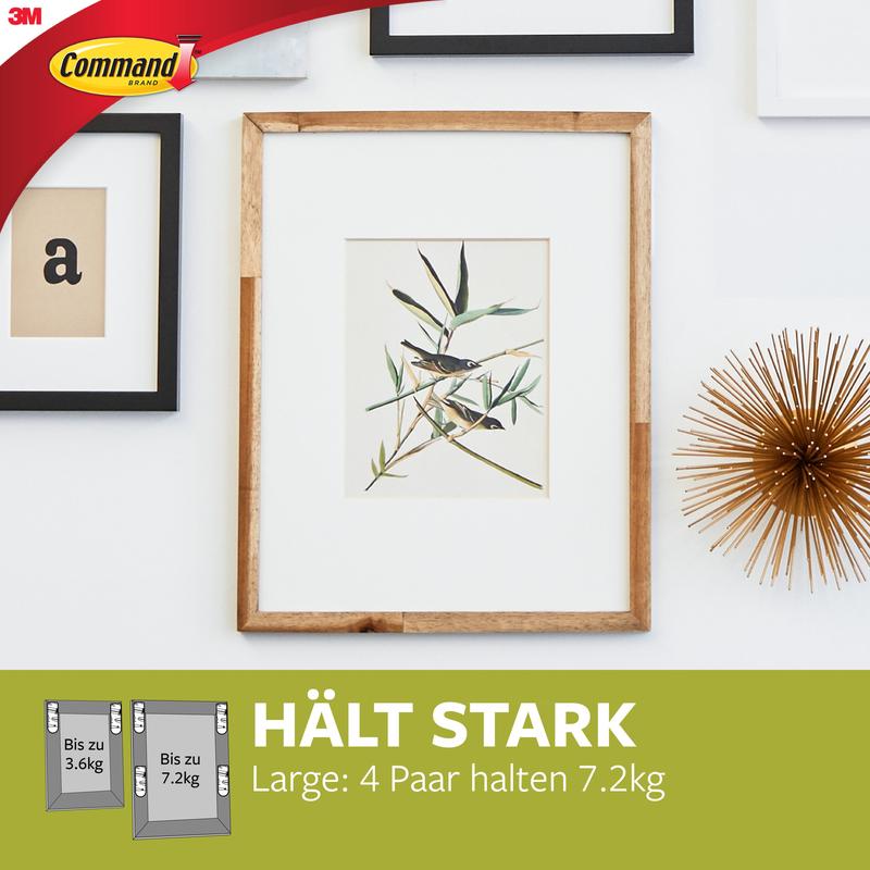 En træramme med botanisk kunst hænger på en hvid væg, fastgjort med Store Command™ Billedophængningsstrips L, 12 sæt i fordelspakke (17206-12) fra 3M Deutschland GmbH - helt uden boring og skadesfrit.