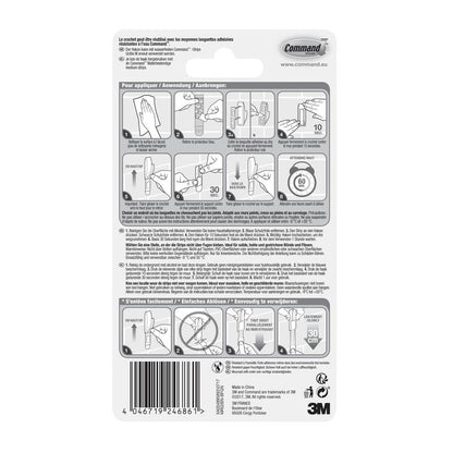 Bagsiden af en Command™ Badeværelsesmetalkrog "Modern Reflection"-emballage fra 3M Deutschland GmbH, med billedlig trin-for-trin vejledning til montering og fjernelse af krogen, med flersproget tekst og produktinformationer nederst.