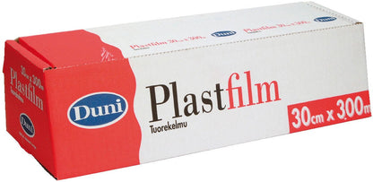 En rektangulær æske fra Duni GmbH med gennemsigtig PVC-fødevarefolie, 300 m, mærket med »30 cm x 300 m«, har et rød-hvidt design med et blåt logo. Den uåbnede æske holder fødevarer friske og har teksten »Tuorekelmu« under produktnavnet.