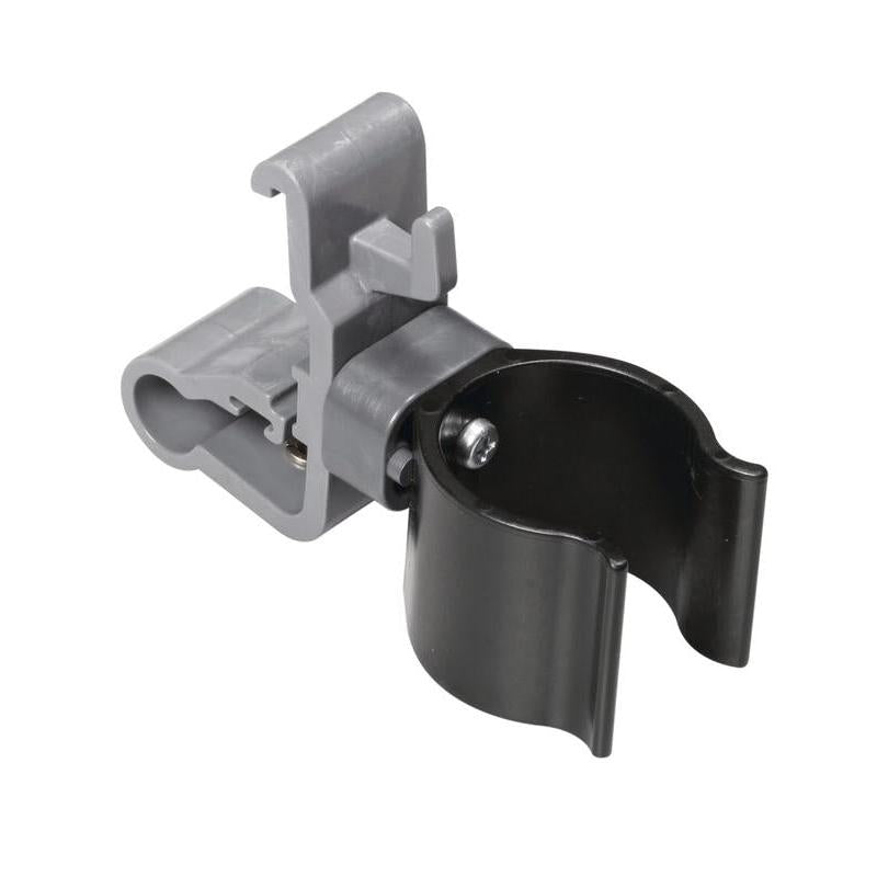 TASKI-holderen til sugeslange fra Diversey Deutschland GmbH & Co. OHG er en grå-sort klemme med klapbar klips, cylindrisk holder og skrueforsegling til sikker fastgørelse på kludeboks holder 7517270/757371 eller tilbehørsholder. Pakke: 1 styk.