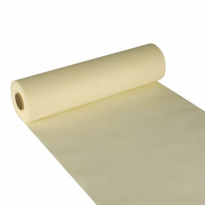 Starpak bordløber, stoflignende fleece „soft selection“ (24 m x 40 cm), i sart gul er her delvist udrullet med synlig indre rør afbildet – perfekt som elegant bordløber til stilfulde omgivelser.