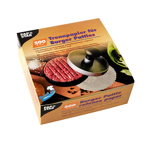 Eine Schachtel PAPSTAR 500 Trennpapiere für Burger Patties Ø 13 cm weiss (500 Stück) von der PAPSTAR GmbH; die Verpackung zeigt eine Burgerpresse mit rohen Patties, Salat, Tomate, Salz und Pfeffer auf weißem Hintergrund.