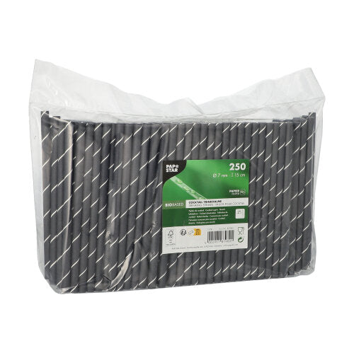 En gennemsigtig plastemballage indeholder 250 PAPSTAR cocktailstrå 7 mm, sort/hvid "Stripes", 15 cm. Etiketten fra PAPSTAR GmbH viser produktinformationer og miljøvenlige symboler.