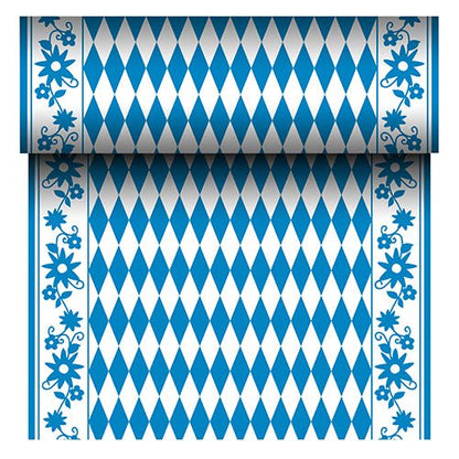 Den PAPSTAR Airlaid-bordløber "Bayrisch Blau" (24 m x 40 cm) fra PAPSTAR GmbH er en stoflignende bordløber med blå-hvidt diamantmønster i midten og en blå blomsterkant. Rullen viser sit gentagne bayerske mønster, når den rulles ud.