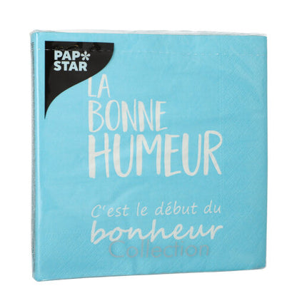En blå pakke PAPSTAR 20 servietter, 33x33 cm, 3-lags, med "La bonne humeur c'est le début du bonheur Collection" i hvid og logoet af PAPSTAR GmbH øverst til venstre.