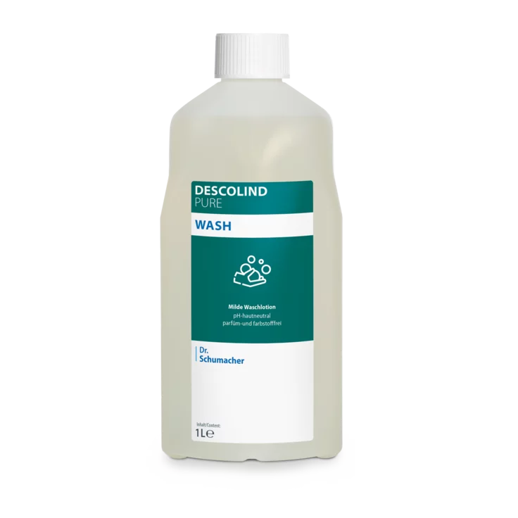 Dr. Schumacher Descolind Pure Wash Waschlotion fra Dr. Schumacher GmbH i en 1-liters plastflaske, pH-neutral og parfume-fri til følsom hud, med hvid hætte og grøn-hvid etiket med produktinformation og håndvasksymbol.