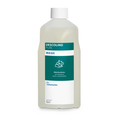 Dr. Schumacher Descolind Pure Wash Waschlotion fra Dr. Schumacher GmbH i en 1-liters plastflaske, pH-neutral og parfume-fri til følsom hud, med hvid hætte og grøn-hvid etiket med produktinformation og håndvasksymbol.