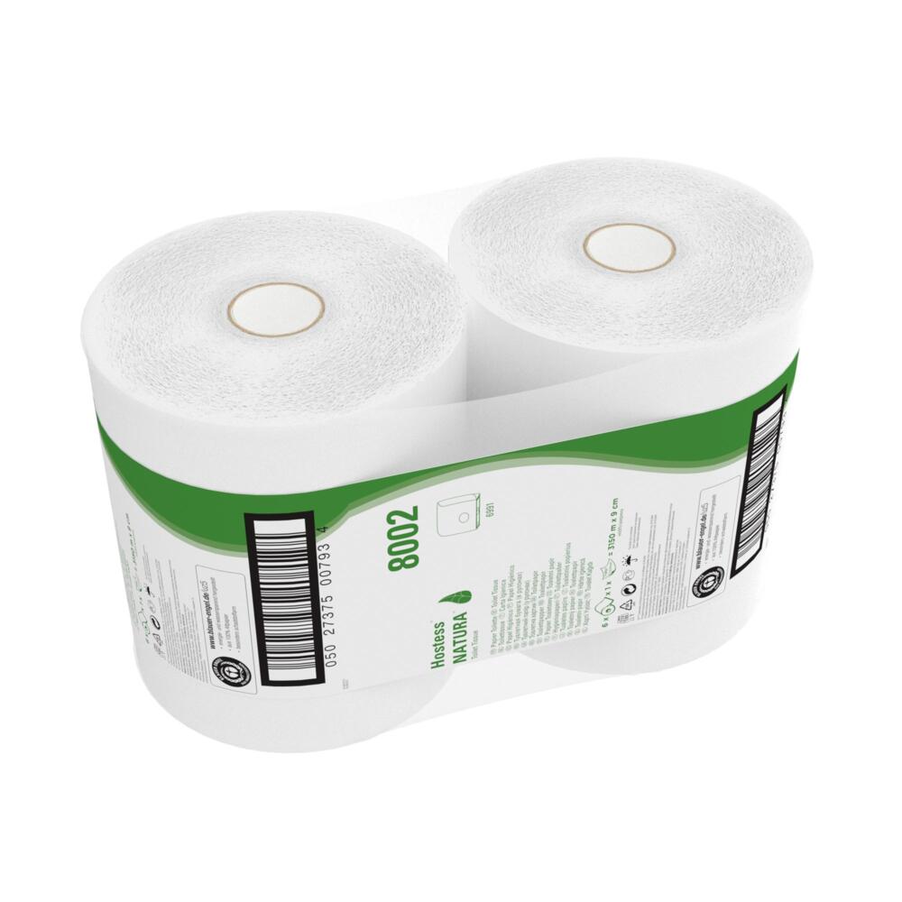 En kasse indeholder seks Jumbo-ruller Hostess™ NATURA toiletpapir (hver 525 m, hvid) fra Kimberly-Clark GmbH, hver pakket i plastik med en grøn-hvid etiket med produktinfo og stregkode.