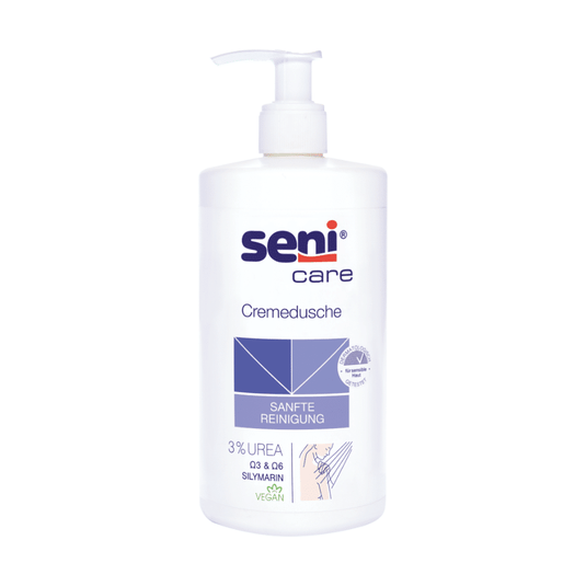 Den Seni Care Cremedusche fra TZMO Deutschland GmbH, 500 ml, indeholder 3 % urea, silymarin og har en vegansk sammensætning. Den hvide flaske har en pumpedispenser og er forsynet med den blå tekst »SANFTE REINIGUNG«, hvilket gør den ideel til tør hud.