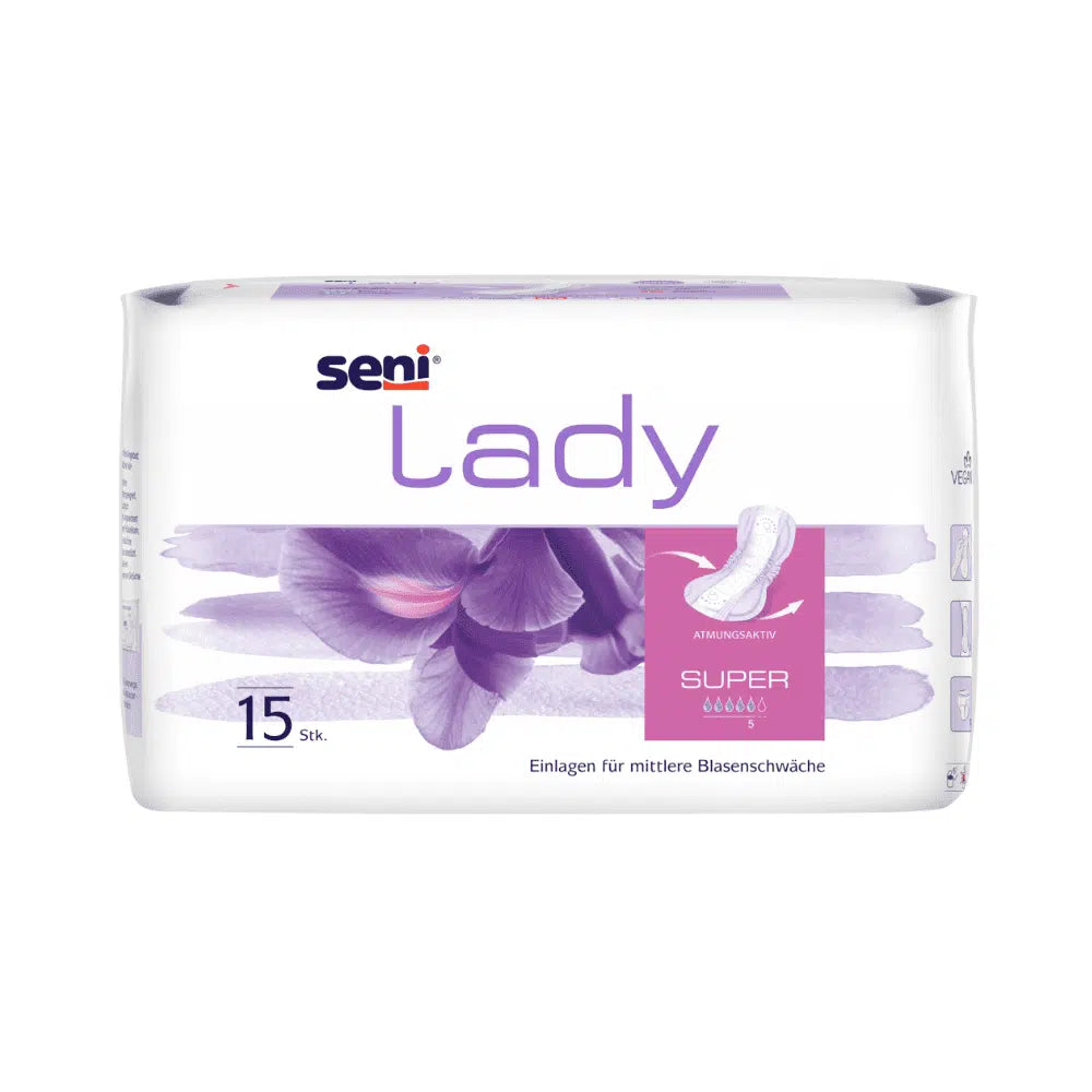 Seni Lady Super inkontinensindlæg fra TZMO Deutschland GmbH er en hvid pakke med violette accenter og blomsterdesign og indeholder 15 indlæg til moderat blæresvaghed. Den tyske tekst indeholder informationer om komfort, egenskaber og sugeevne.