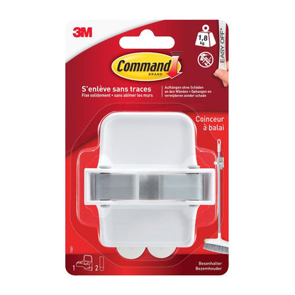 En hvid Command™ kostholder 17007-FR fra 3M Deutschland GmbH i en plastikemballage med rød baggrund, fransk tekst, Command klæbestrimmel-branding og en kostillustration ved siden af holderen.