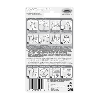 Bagsiden af en Command™ Bad Medium Designer-kroge, 17081B fra 3M Deutschland GmbH-pakning viser illustrerede trin for opsætning og nedtagning, flersproget tekst, sikkerhedsadvarsler og en stregkode nederst.