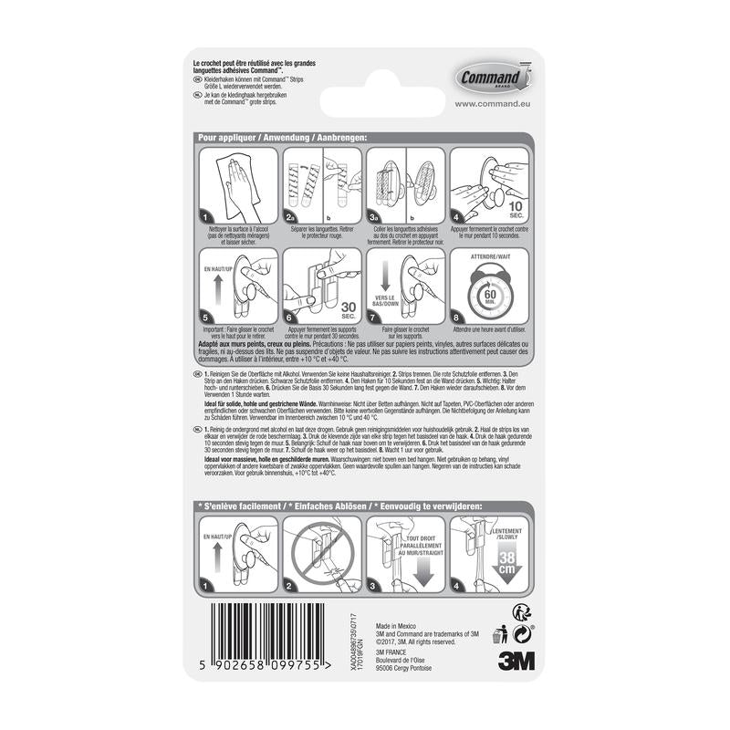 Bagsiden af en Command™ tøjkrog, 17019-FGN-pakke fra 3M Deutschland GmbH viser en trin-for-trin billedvejledning til vægmontering uden boring, advarsler, produktdetaljer, stregkoden og 3M-logoet i sort-hvid.